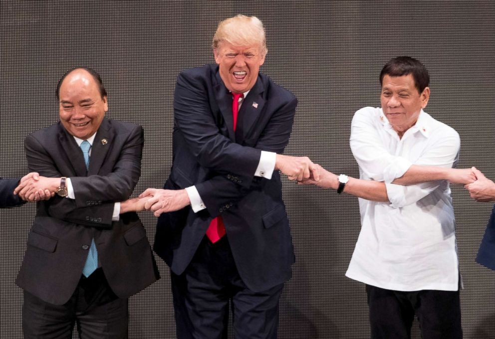 trump-asia-asean-handshake-7-jt-171113_19x13_992.jpg